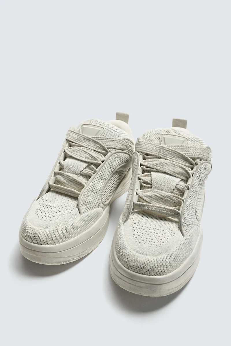 DISTRESSED THICK-SOLED SNEAKERS