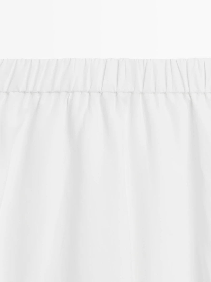 Flowing midi skirt with elastic detail