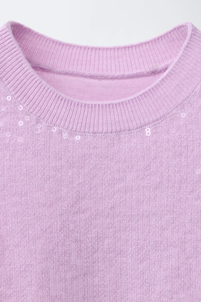 TOP EN MAILLE À SEQUINS