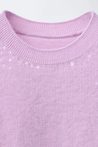 TOP EN MAILLE À SEQUINS