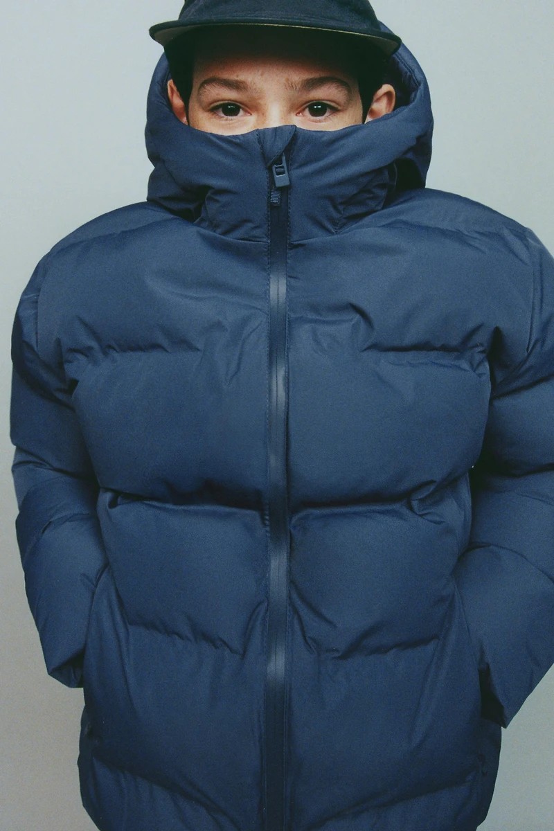 MANTEAU REMBOURRÉ ÉTIQUETTE DÉPERLANT