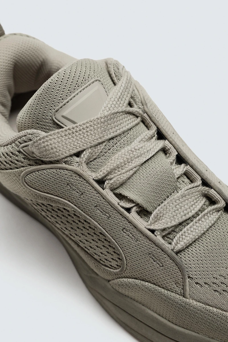 DISTRESSED THICK-SOLED SNEAKERS