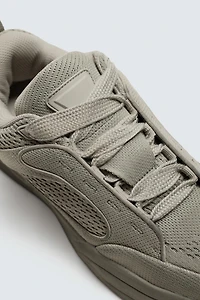 DISTRESSED THICK-SOLED SNEAKERS