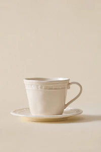STONEWARE RAISED DESIGN COFFEE CUP AND SAUCER