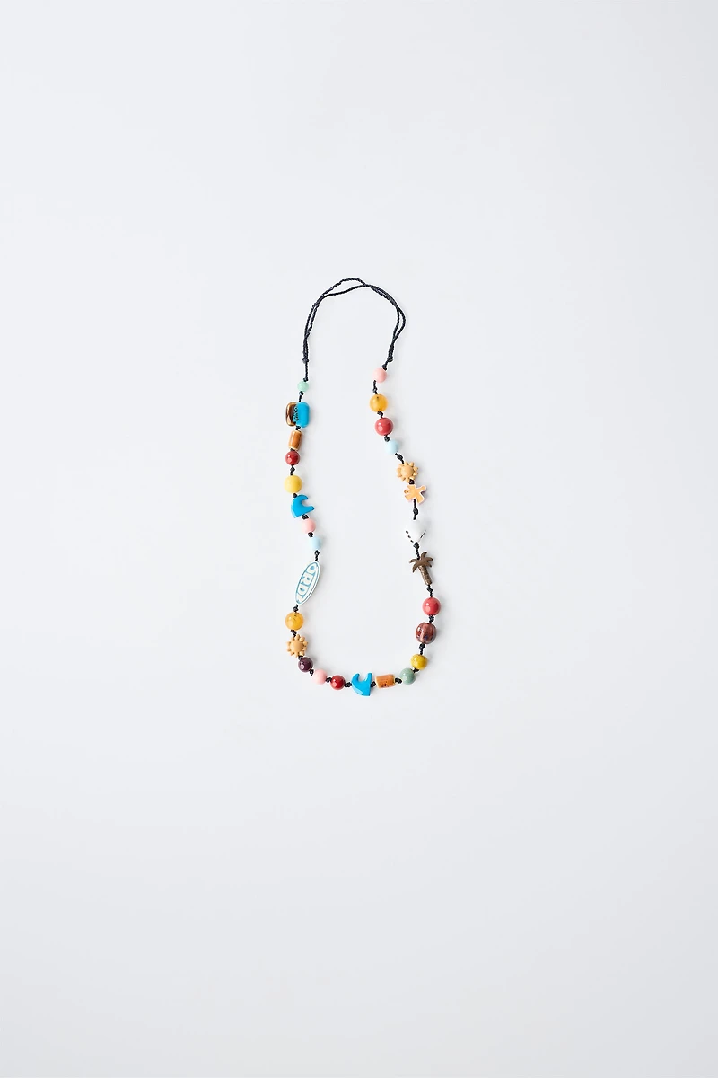 COLLIER LACET FANTAISE LOGO