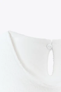 TOP PÉPLUM BOUCLE À