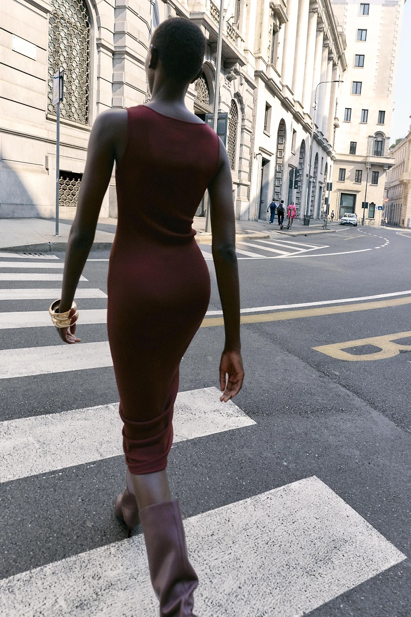 CUT OUT KNIT DRESS WITH METAL DETAIL
