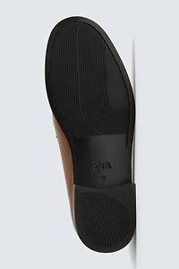 MOCASSINS EN CUIR À MASQUE