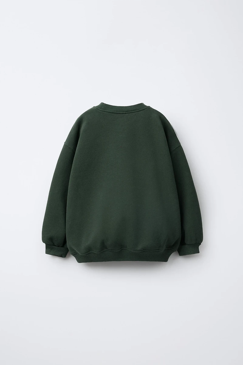 FAUX SHEARLING BEAR PATCH SWEATSHIRT