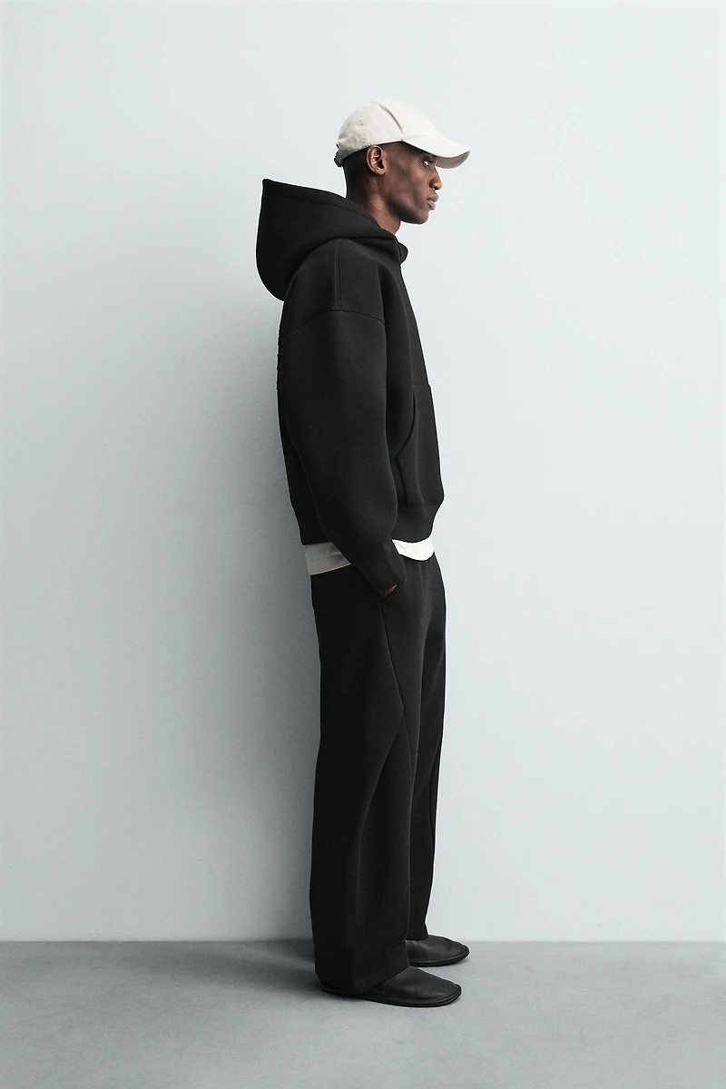 RAISED TEXT NEOPRENE EFFECT SWEATSHIRT