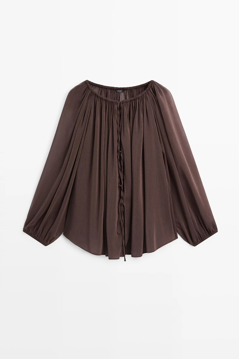 Flowing shirt with gathered details