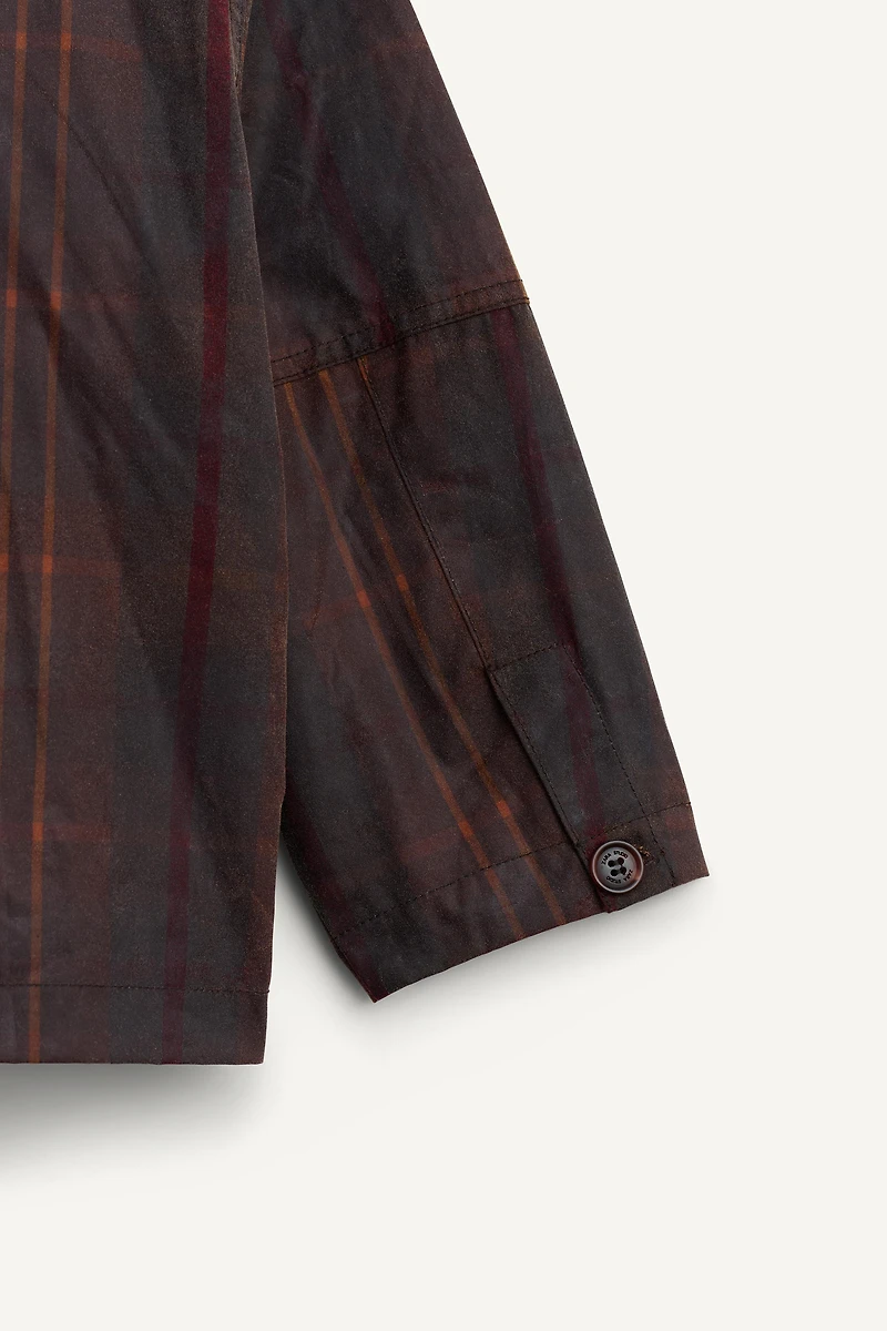 MANTEAU À CARREAUX CIRÉ ÉDITION LIMITÉE