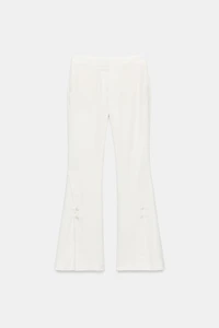 PANTALON À OUVERTURES SUR LE BAS