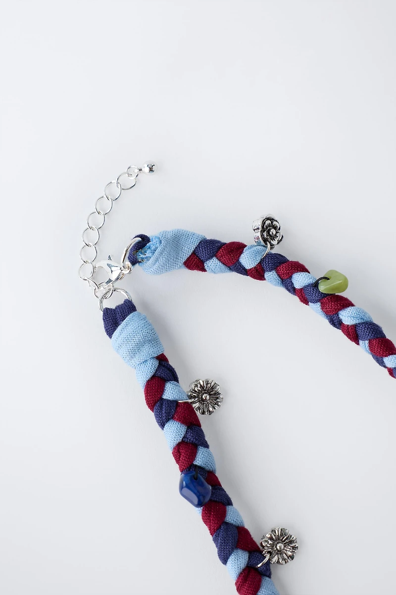 BRAIDED NECKLACE WITH FLOWER PENDANTS