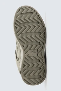 DISTRESSED THICK-SOLED SNEAKERS