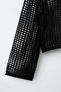 PULL EN RÉSILLE À CAPUCHE