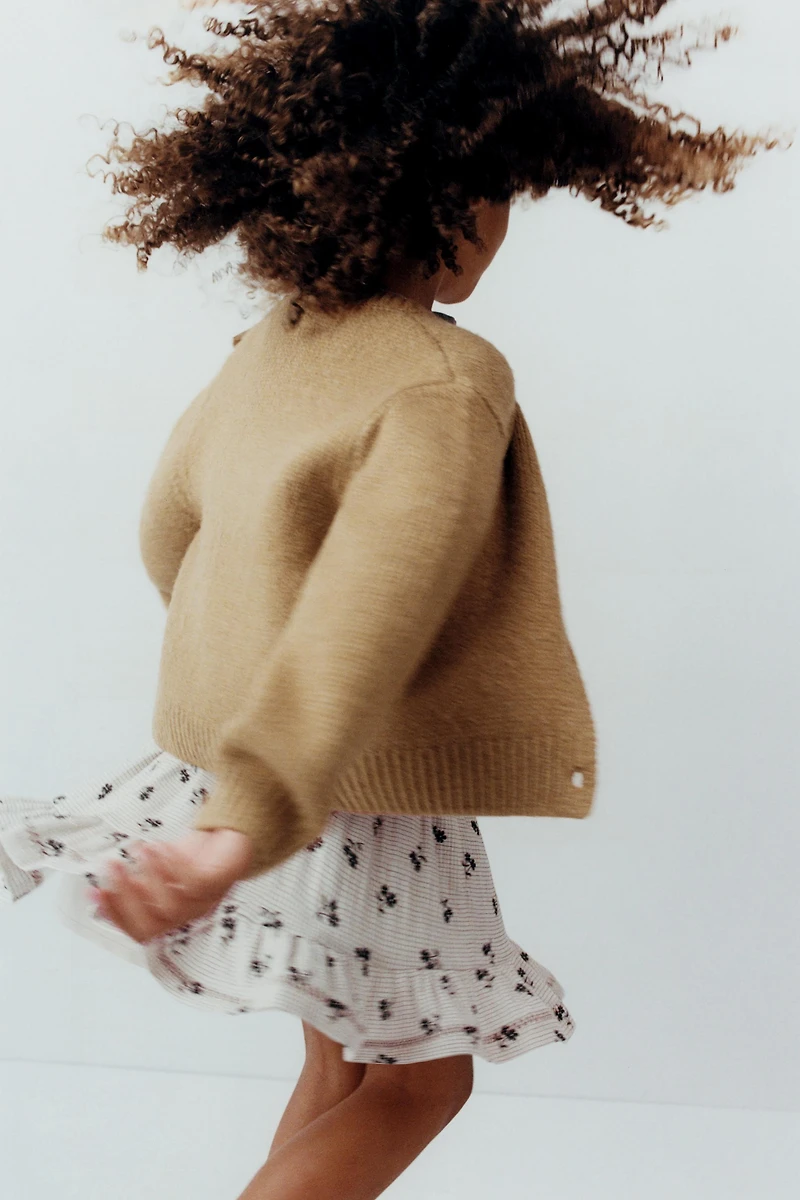 GILET EN MAILLE AVEC NOEUD ORGANZA