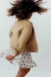 GILET EN MAILLE AVEC NOEUD ORGANZA