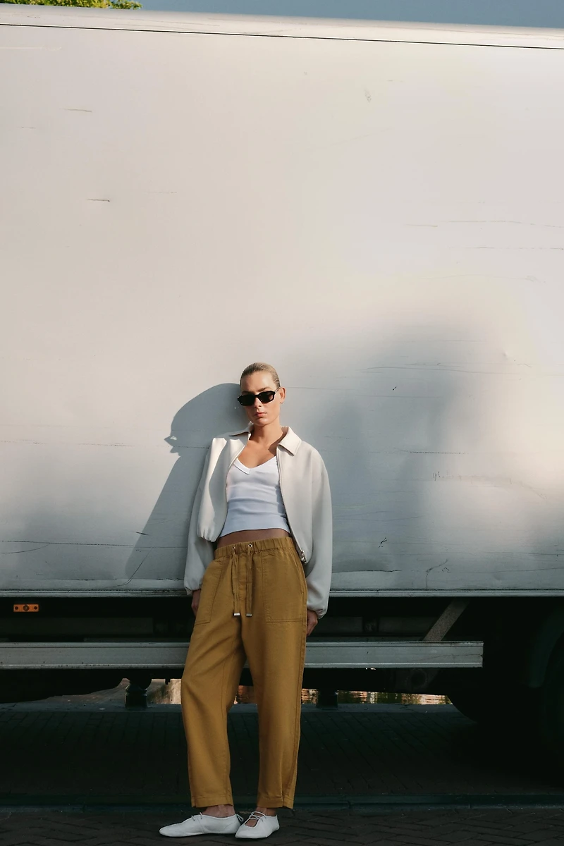 BALLERINES EN CUIR AVEC SURPIQÛRES