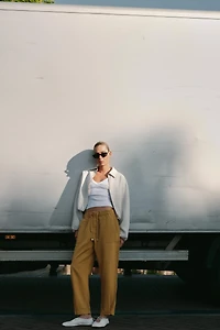 BALLERINES EN CUIR AVEC SURPIQÛRES