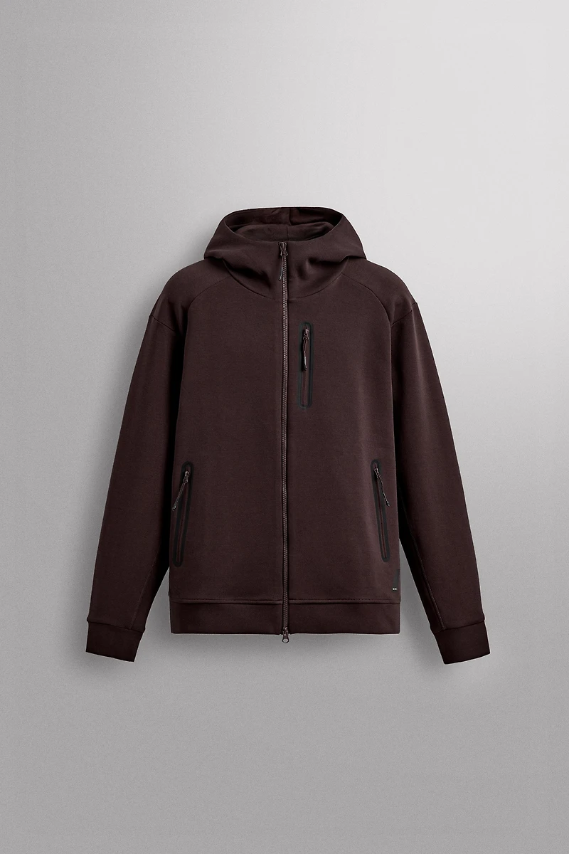 SWEAT TECHNIQUE ZIPPÉ À CAPUCHE