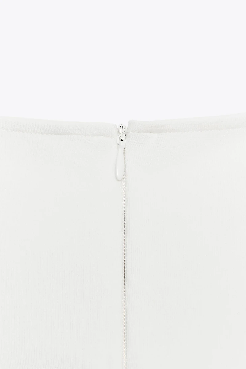 INTERLOCK PEPLUM TOP