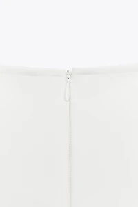 INTERLOCK PEPLUM TOP
