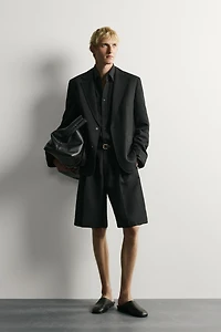 TEXTURED PLEATED SUIT SHORTS