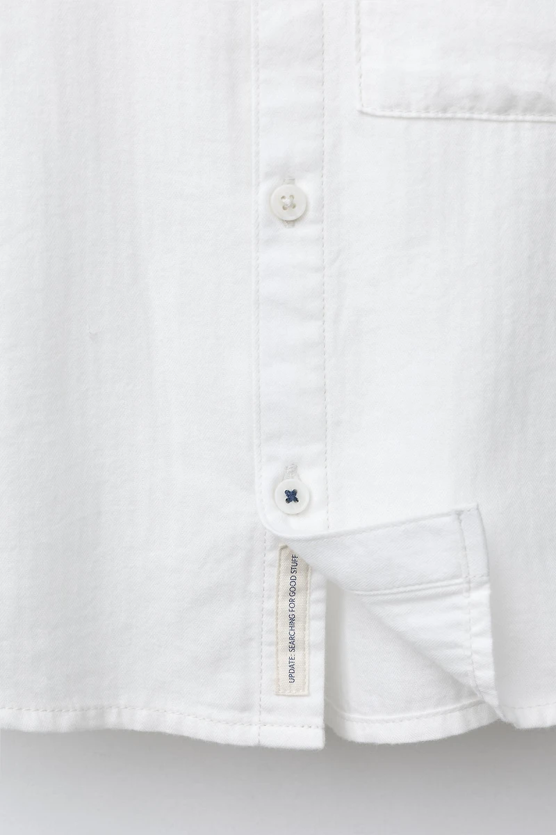 CHEMISE UNIE À POCHE