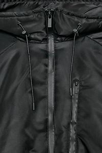 VESTE MATELASSÉE À CAPUCHE DÉPERLANTE ET COUPE-VENT