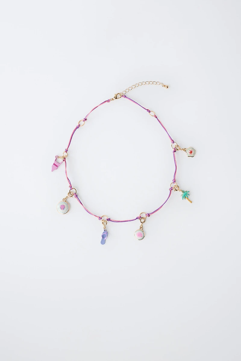 INTERCHANGEABLE MULTI-CHARM NECKLACE