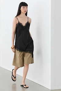Asymmetric thin strap camisole top