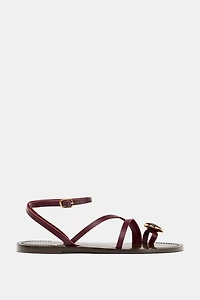 FLAT LEATHER SANDALS WITH DECORATIVE STRAPS