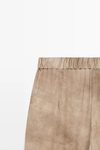 Flowing pants with tie-detail hem