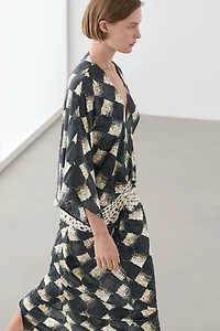 Flowing dress with sash belt detail