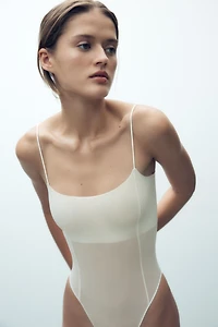 FITTED STRAPPY BODYSUIT WITH SEAMS