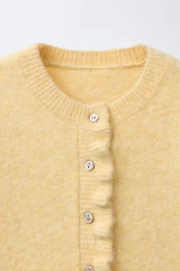 GILET EN MAILLE VOLANTS AVEC LAINE