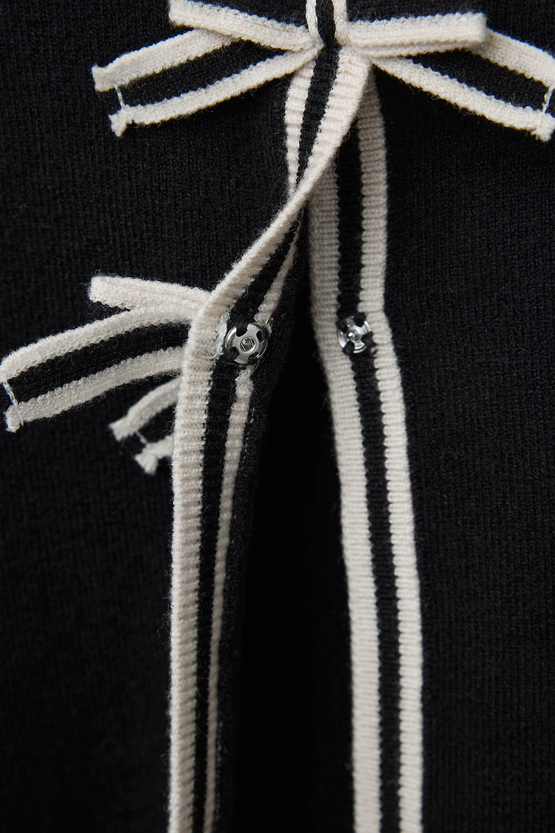 GILET EN MAILLE À NŒUDS