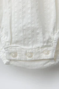 EMBROIDERED LADDER STITCH BODYSUIT