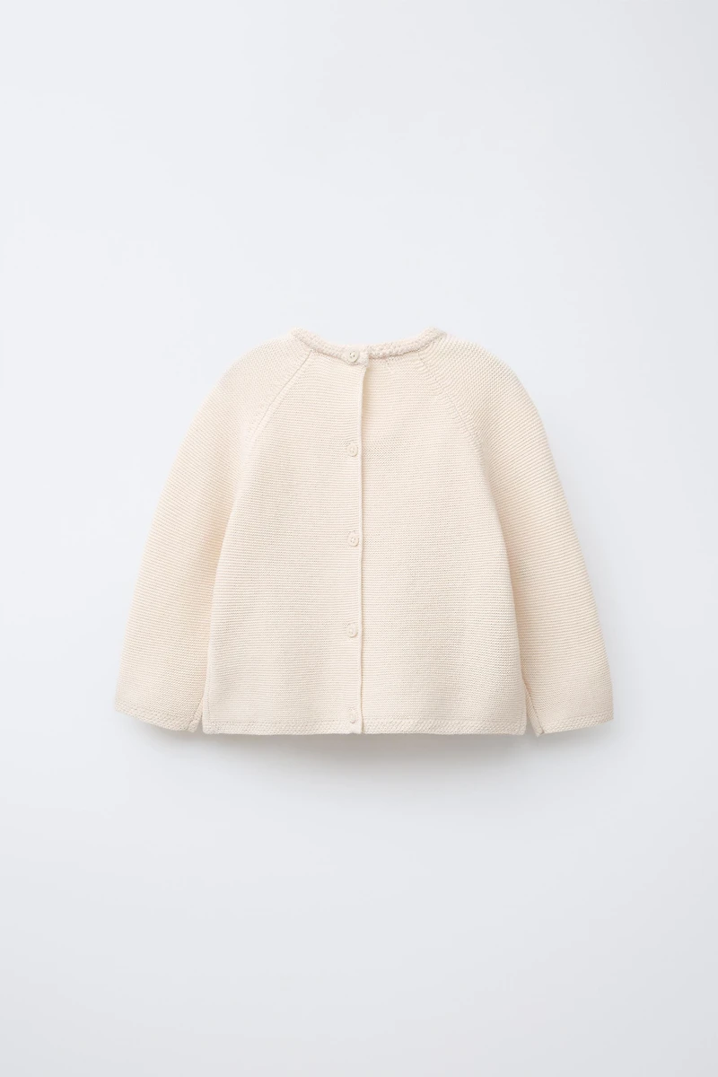 EMBROIDERED FLORAL LINKS KNIT SWEATER