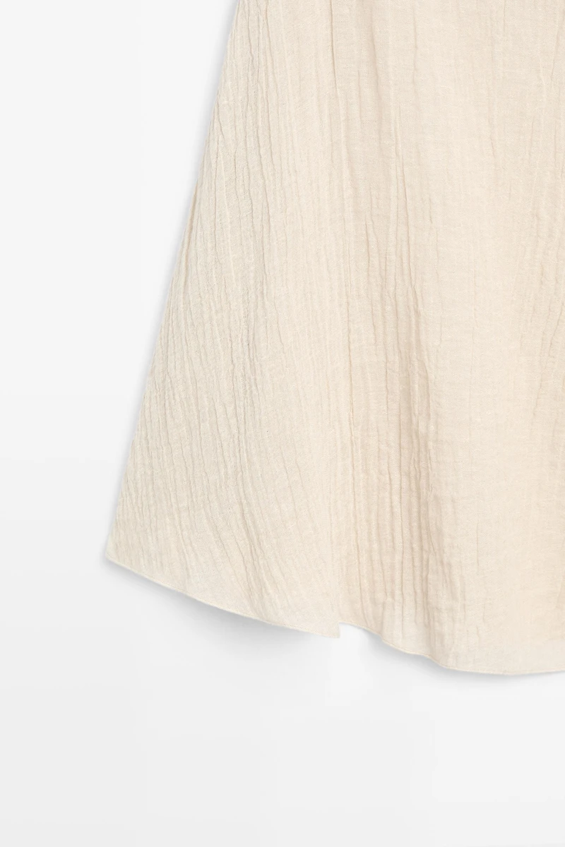Top cape asymétrique total look lin mélangé