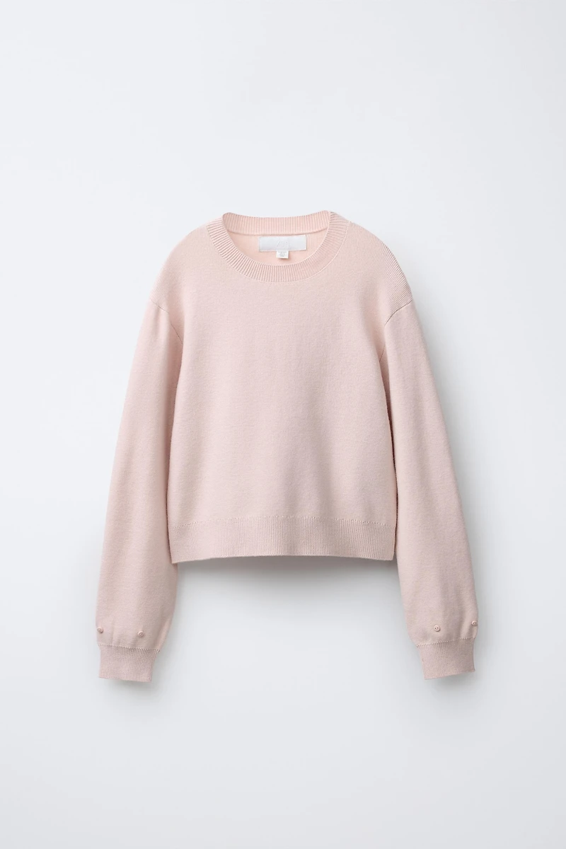 PULL EN MAILLE À PLUMES