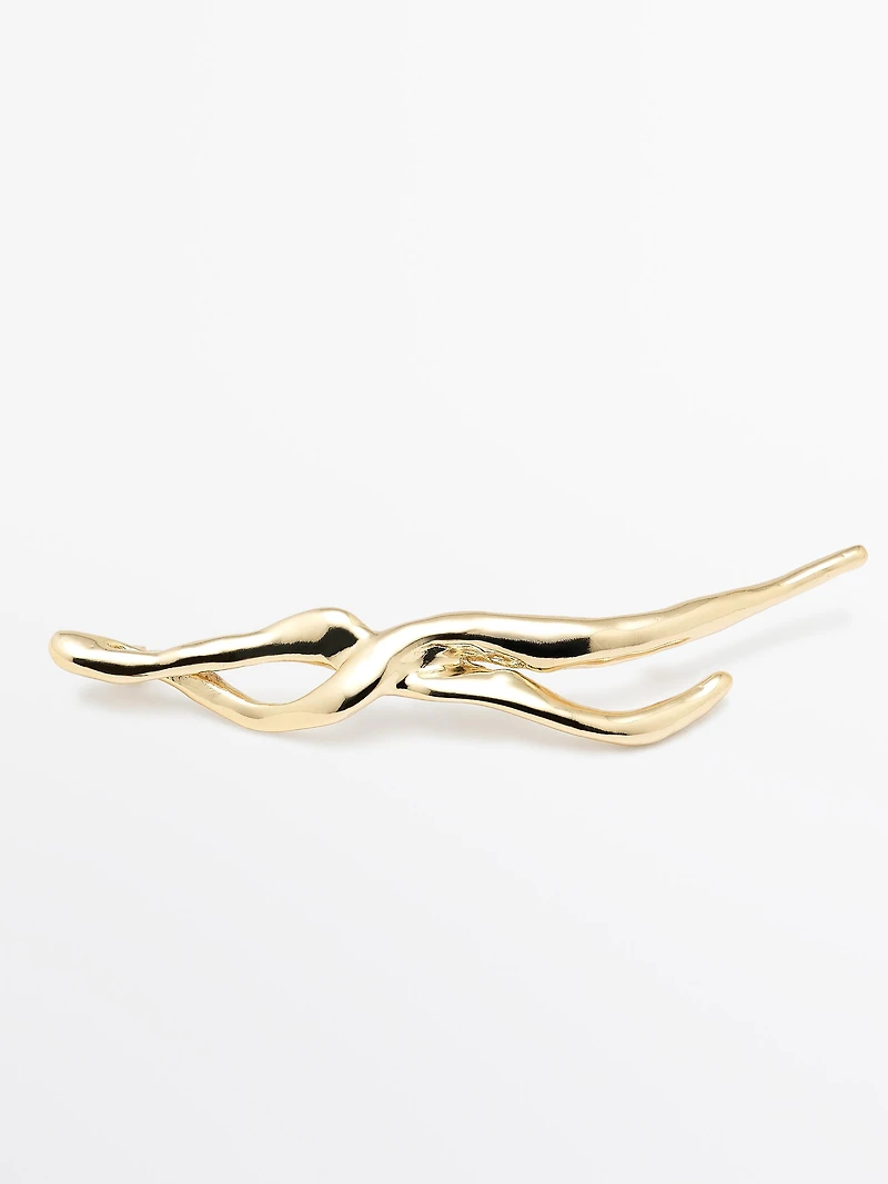 Abstract metal brooch