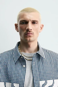 CHEMISE BOXY FIT À CARREAUX ET PIÈCES CONTRASTANTES