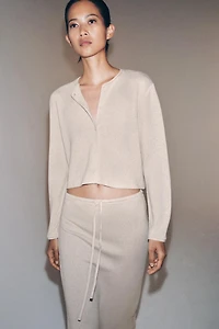 GILET À BOUTONS MANCHES LONGUES