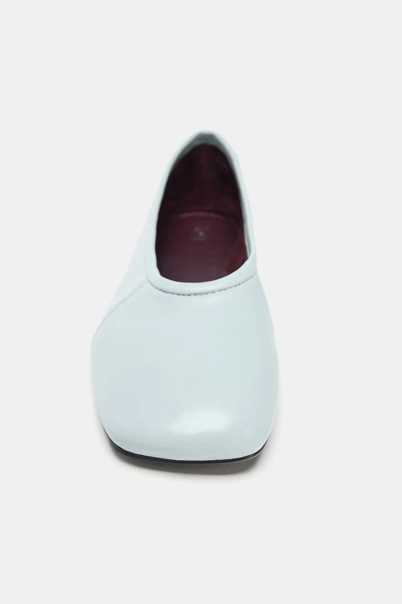 BALLERINES EN CUIR AVEC SURPIQÛRES