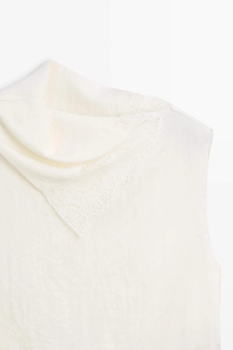 Asymmetric roll neck top with lace detail