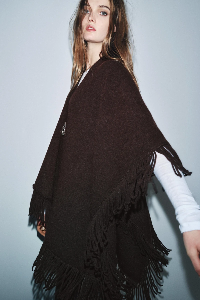 FRINGED KNIT CAPE