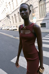 CUT OUT KNIT DRESS WITH METAL DETAIL