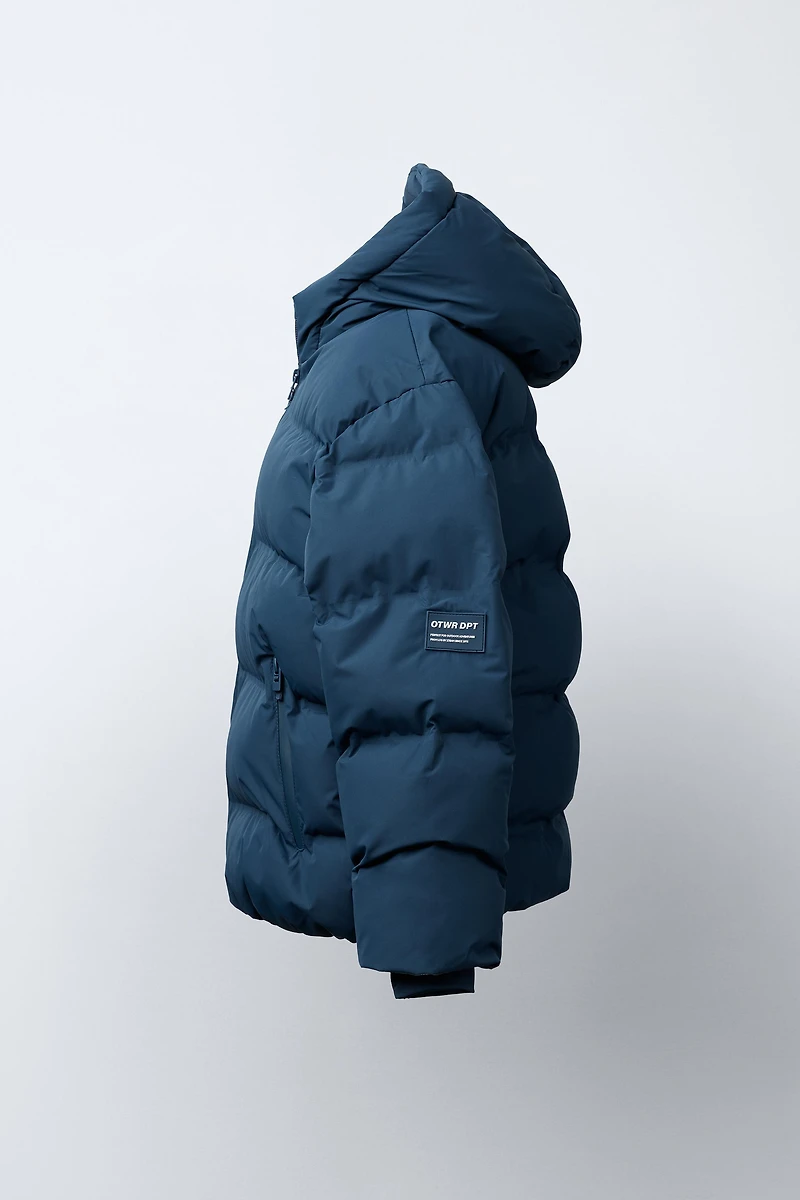 MANTEAU REMBOURRÉ ÉTIQUETTE DÉPERLANT